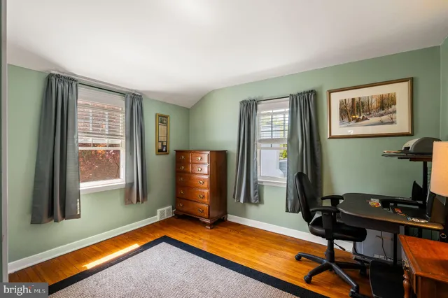 a room with furniture pool table and windows