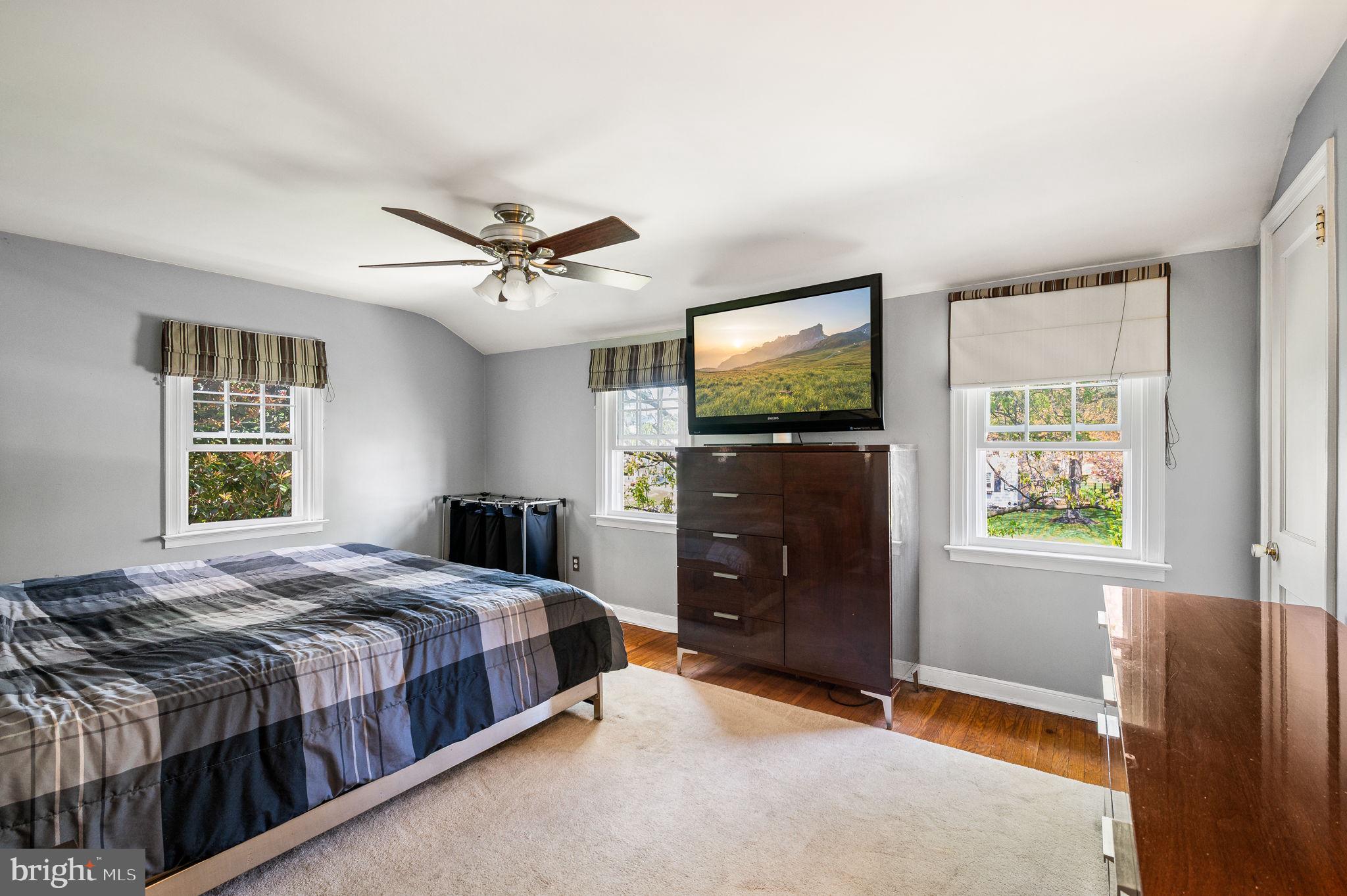 416 Preston Lane Hatboro, PA 19040 - Photo 17 of 24 a bedroom with a bed and a flat screen tv