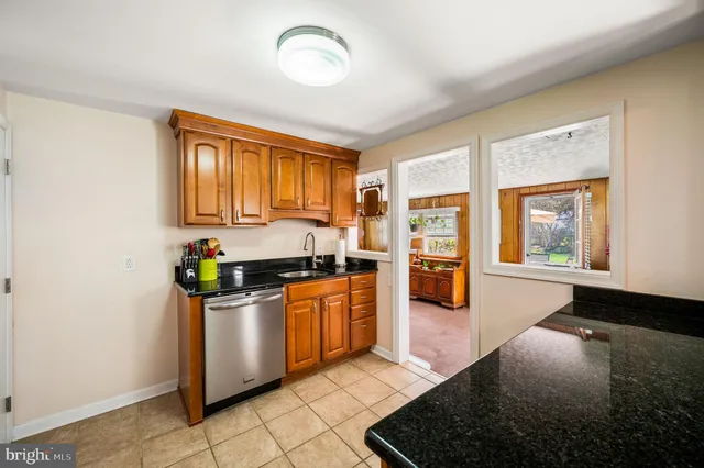 a kitchen with stainless steel appliances granite countertop a refrigerator and stove