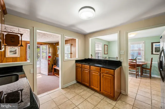 a kitchen with stainless steel appliances granite countertop a stove and a sink