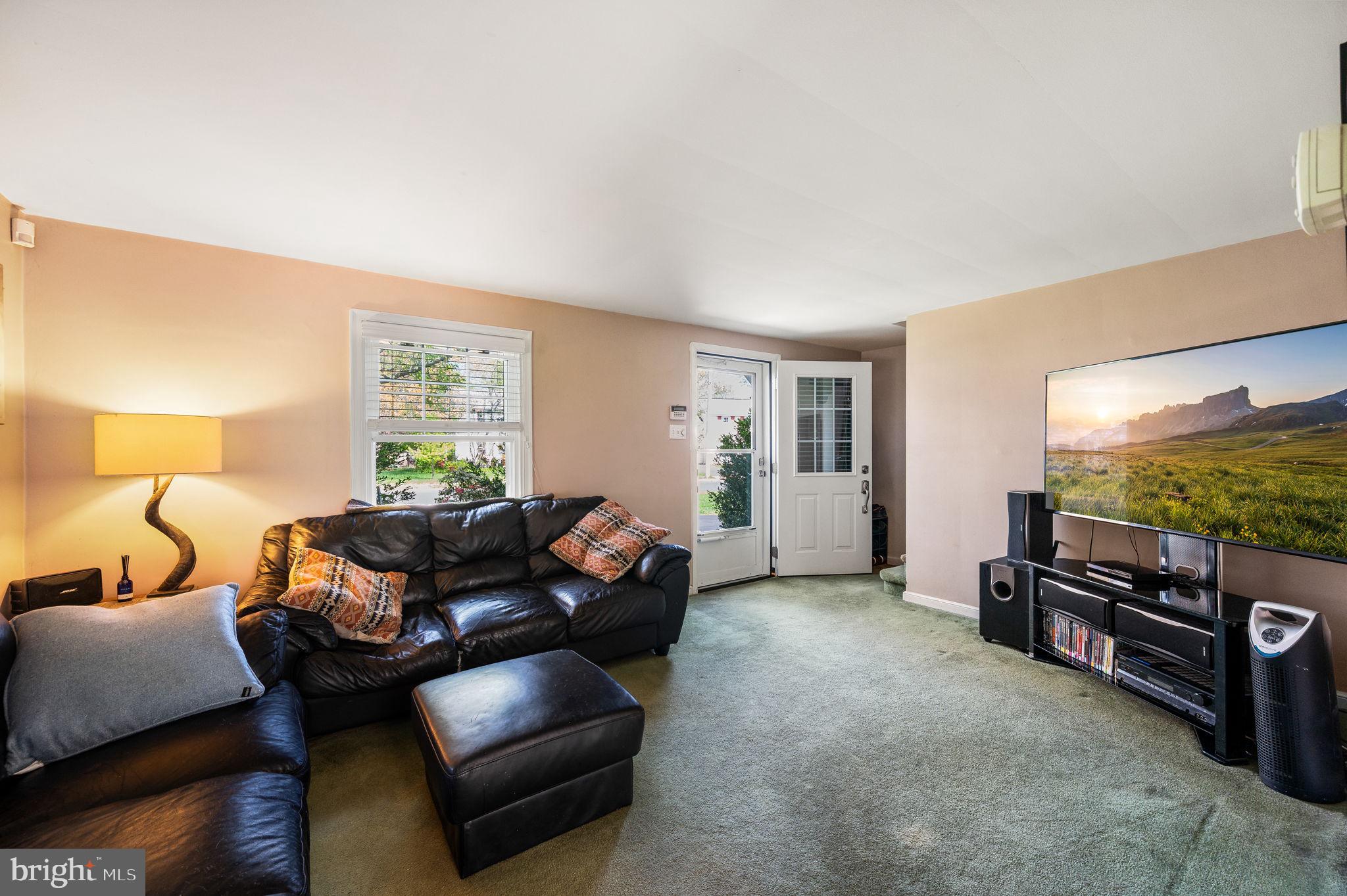 416 Preston Lane Hatboro, PA 19040 - Photo 9 of 24 a living room with furniture and a flat screen tv