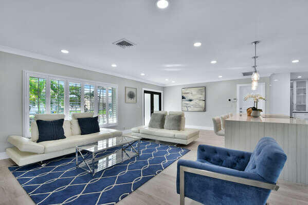 839 Enfield Street Boca Raton, FL 33487 - Photo 32 of 36 a living room with furniture and a rug