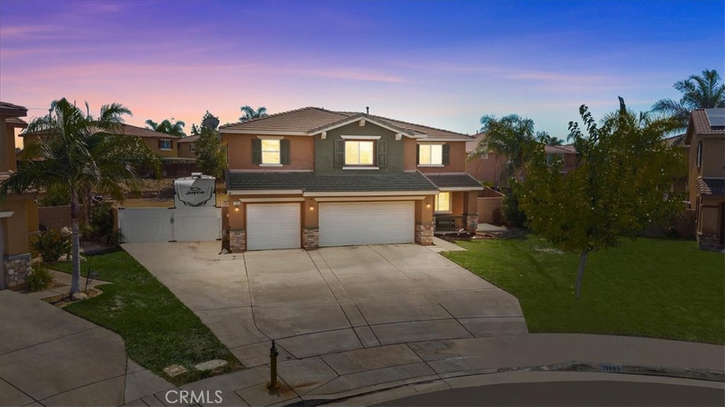 19883 San Juan Capistrano Court Riverside, CA 92508 - Photo 1 of 1 a front view of a house with a yard and garage