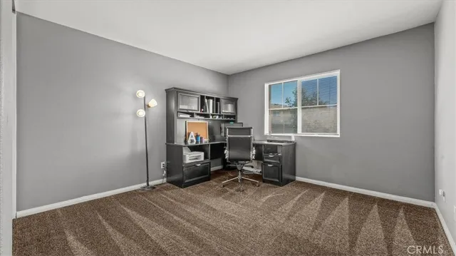 a bedroom with a workspace