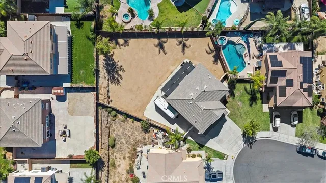 an aerial view of houses with outdoor space