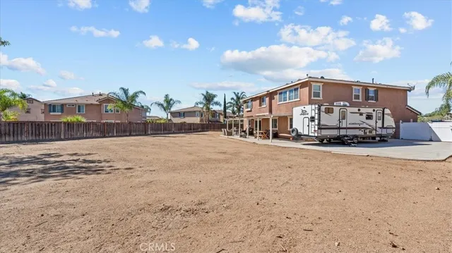 a front view of a house with a big yard