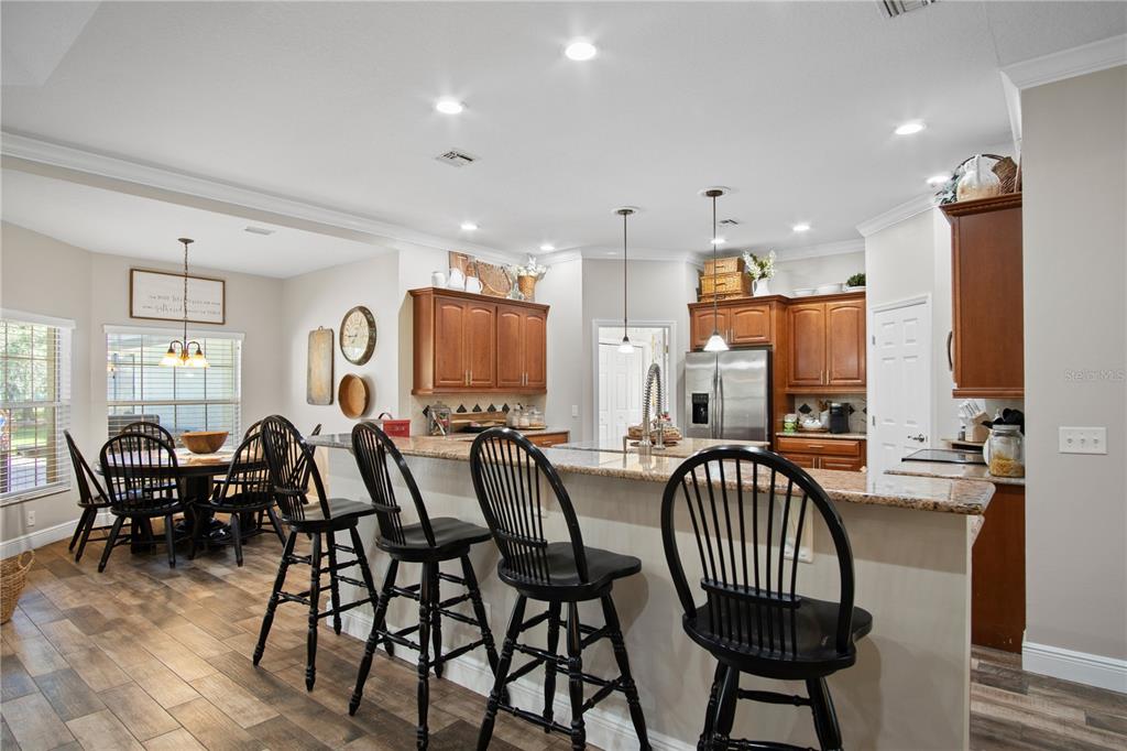 9045 Lake Hatchineha Road Kissimmee, FL 34759 - Photo 21 of 47 a view of a dining room with furniture