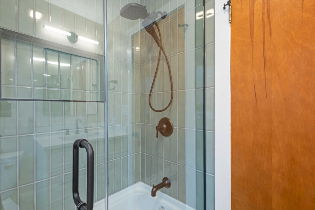 1619 North 20th Avenue Melrose Park, IL 60160 - Photo 13 of 40 a bathroom with a glass shower door