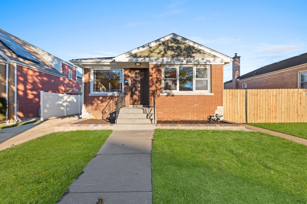 1619 North 20th Avenue Melrose Park, IL 60160 - Photo 40 of 40 a front view of a house with a yard