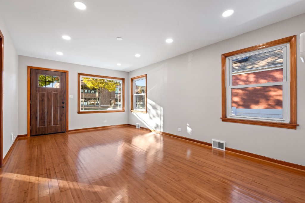 1619 North 20th Avenue Melrose Park, IL 60160 - Photo 4 of 40 a view of an empty room with wooden floor and a window