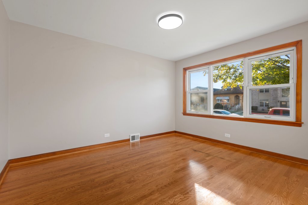 1619 North 20th Avenue Melrose Park, IL 60160 - Photo 7 of 40 a view of an empty room with a window