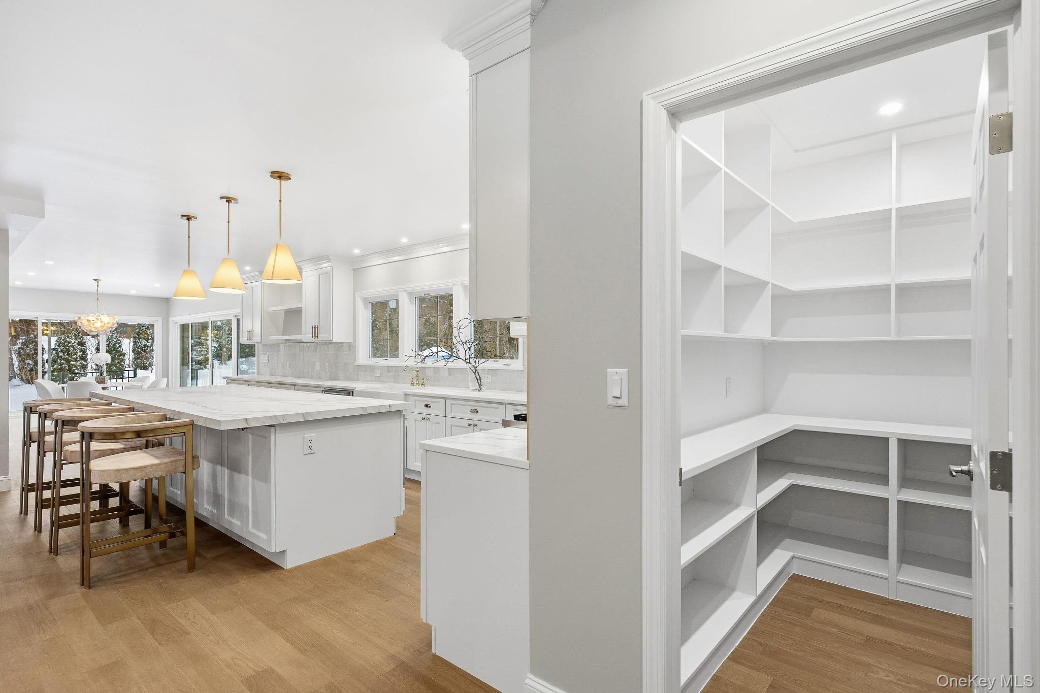 2 Wynmor Road Scarsdale, NY 10583 - Photo 11 of 38 a view of a kitchen with kitchen island and stainless steel appliances