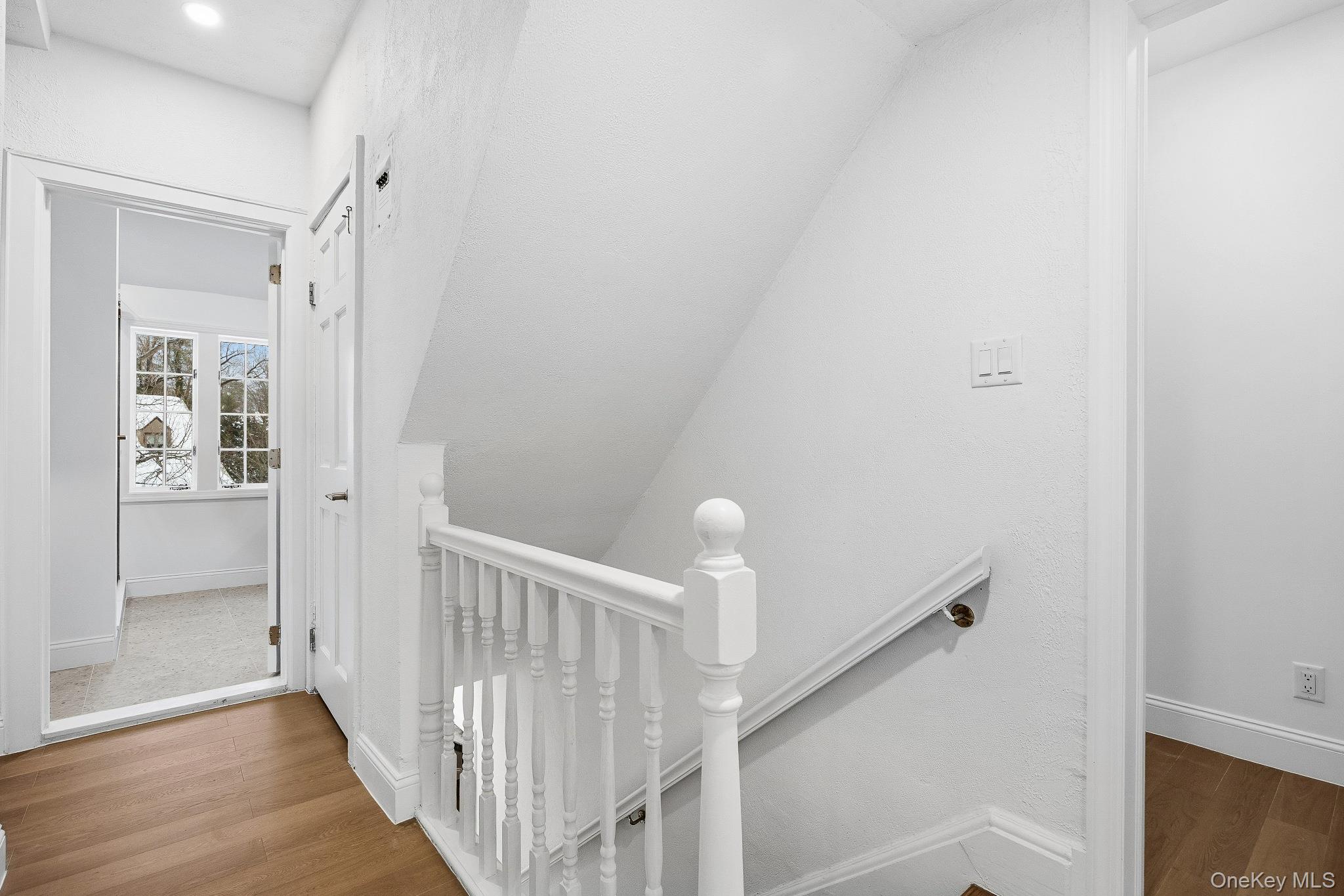 2 Wynmor Road Scarsdale, NY 10583 - Photo 19 of 38 a view of a hallway with wooden floor and entryway