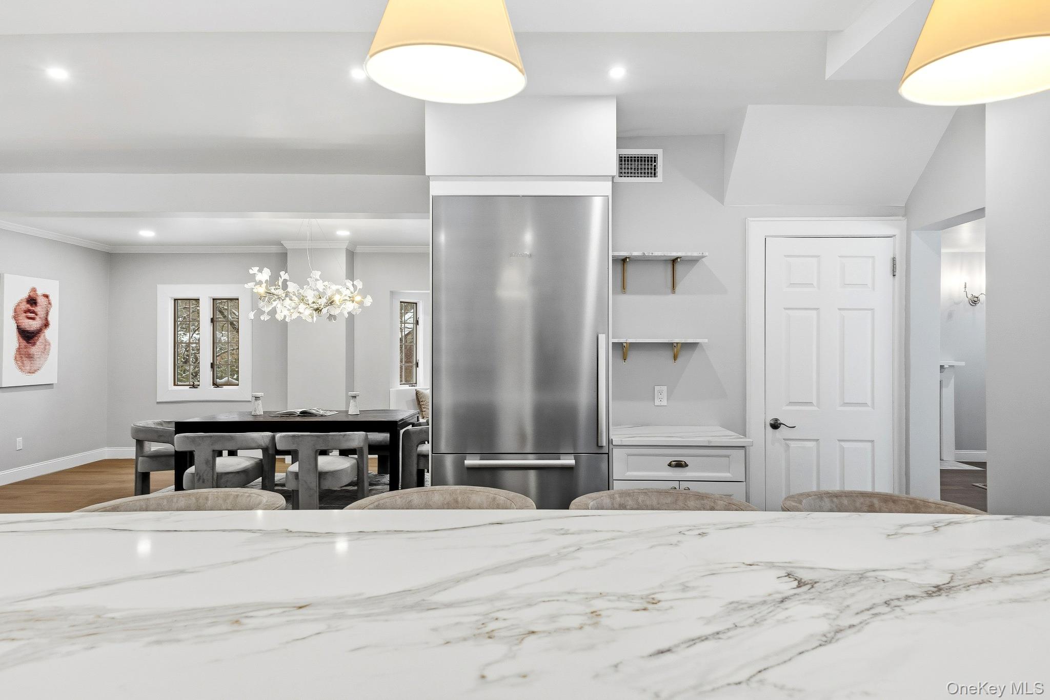 2 Wynmor Road Scarsdale, NY 10583 - Photo 8 of 38 a view of a bathroom with a double vanity sink and a mirror