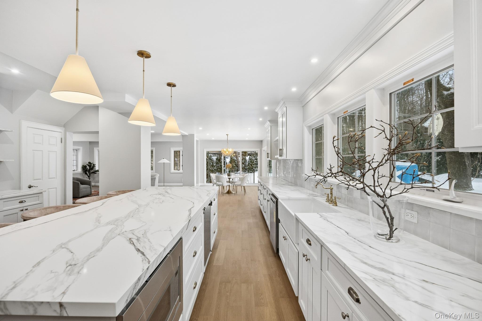 2 Wynmor Road Scarsdale, NY 10583 - Photo 10 of 38 a large white kitchen with a sink and a large window