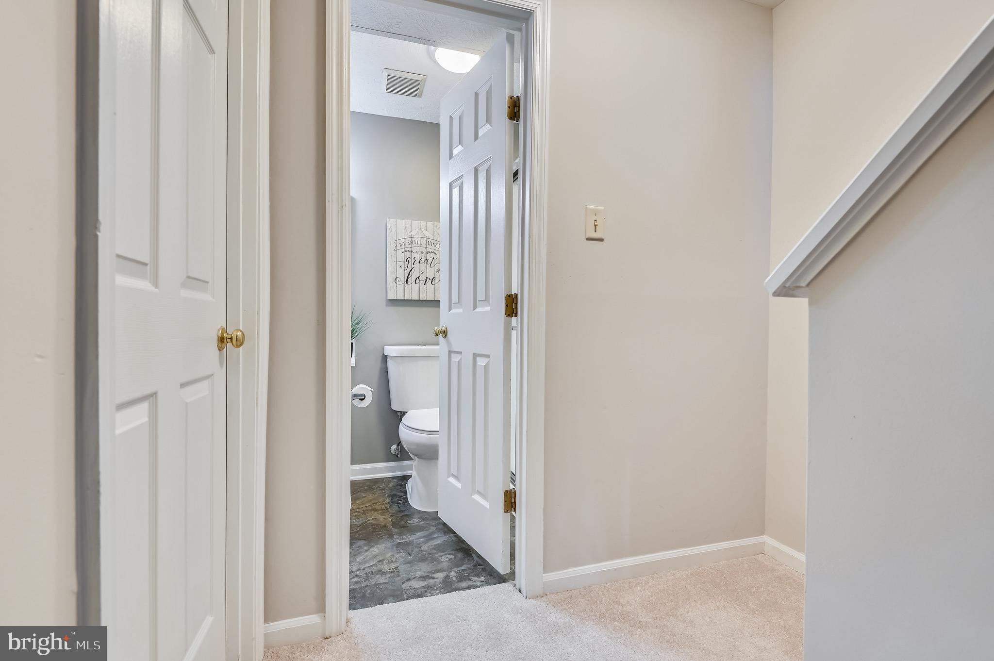 2240 Riding Crop Way Baltimore, MD 21244 - Photo 26 of 38 a view of a bathroom from a hallway