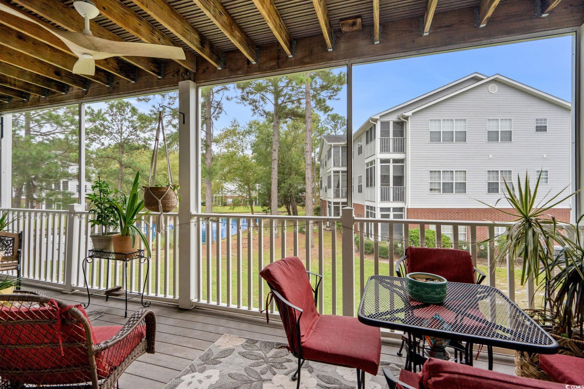 4849 Meadowsweet Drive, Unit 1606 Myrtle Beach, SC 29579 - Photo 13 of 36 Sunroom / solarium with a ceiling fan, a balcony, and outdoor dining space