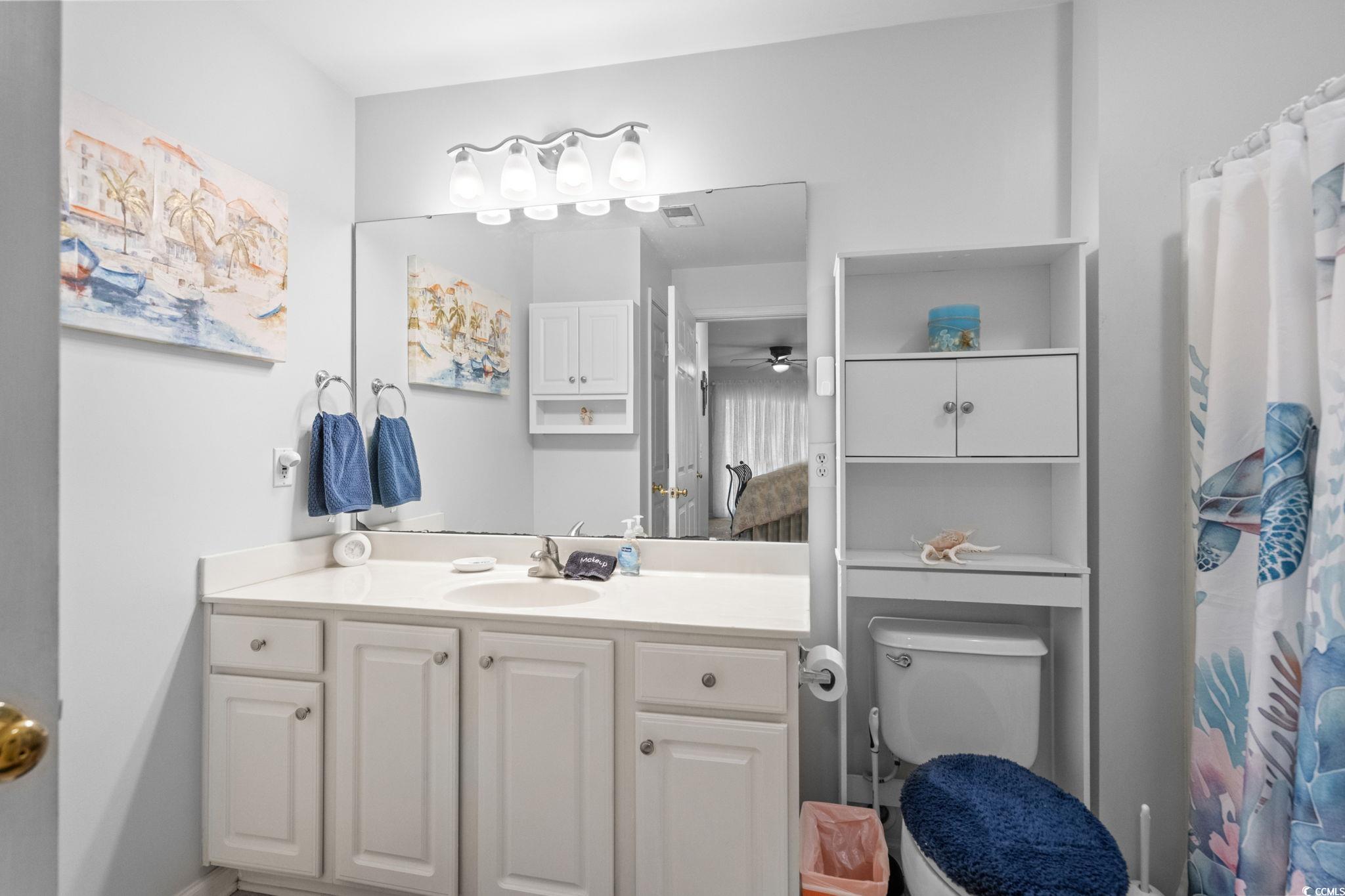 4849 Meadowsweet Drive, Unit 1606 Myrtle Beach, SC 29579 - Photo 20 of 36 Bathroom featuring vanity and a ceiling fan