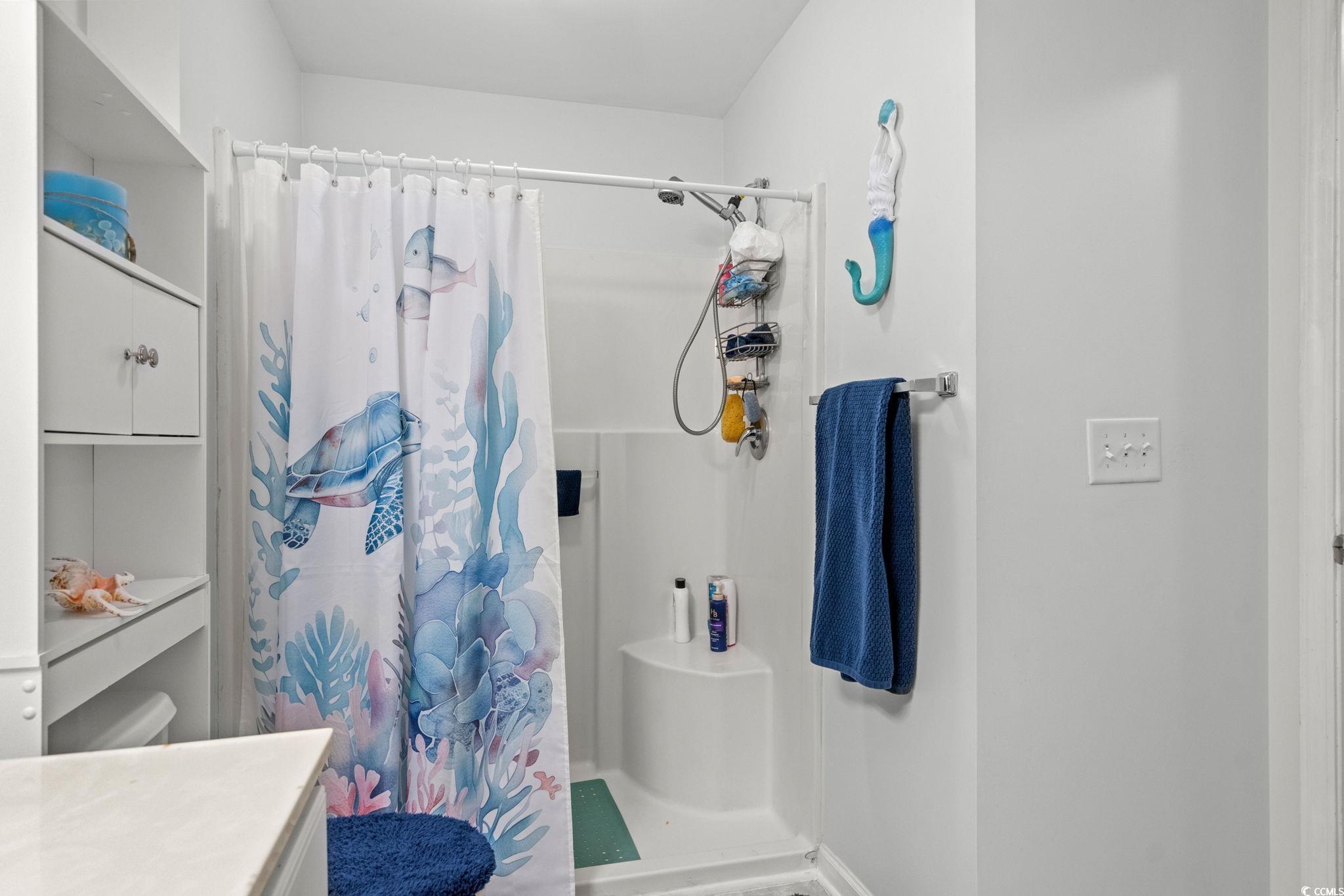 4849 Meadowsweet Drive, Unit 1606 Myrtle Beach, SC 29579 - Photo 21 of 36 Bathroom featuring vanity and a shower stall