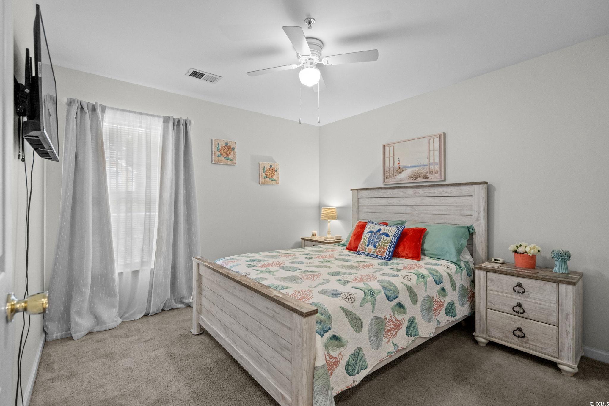 4849 Meadowsweet Drive, Unit 1606 Myrtle Beach, SC 29579 - Photo 22 of 36 Carpeted bedroom featuring ceiling fan