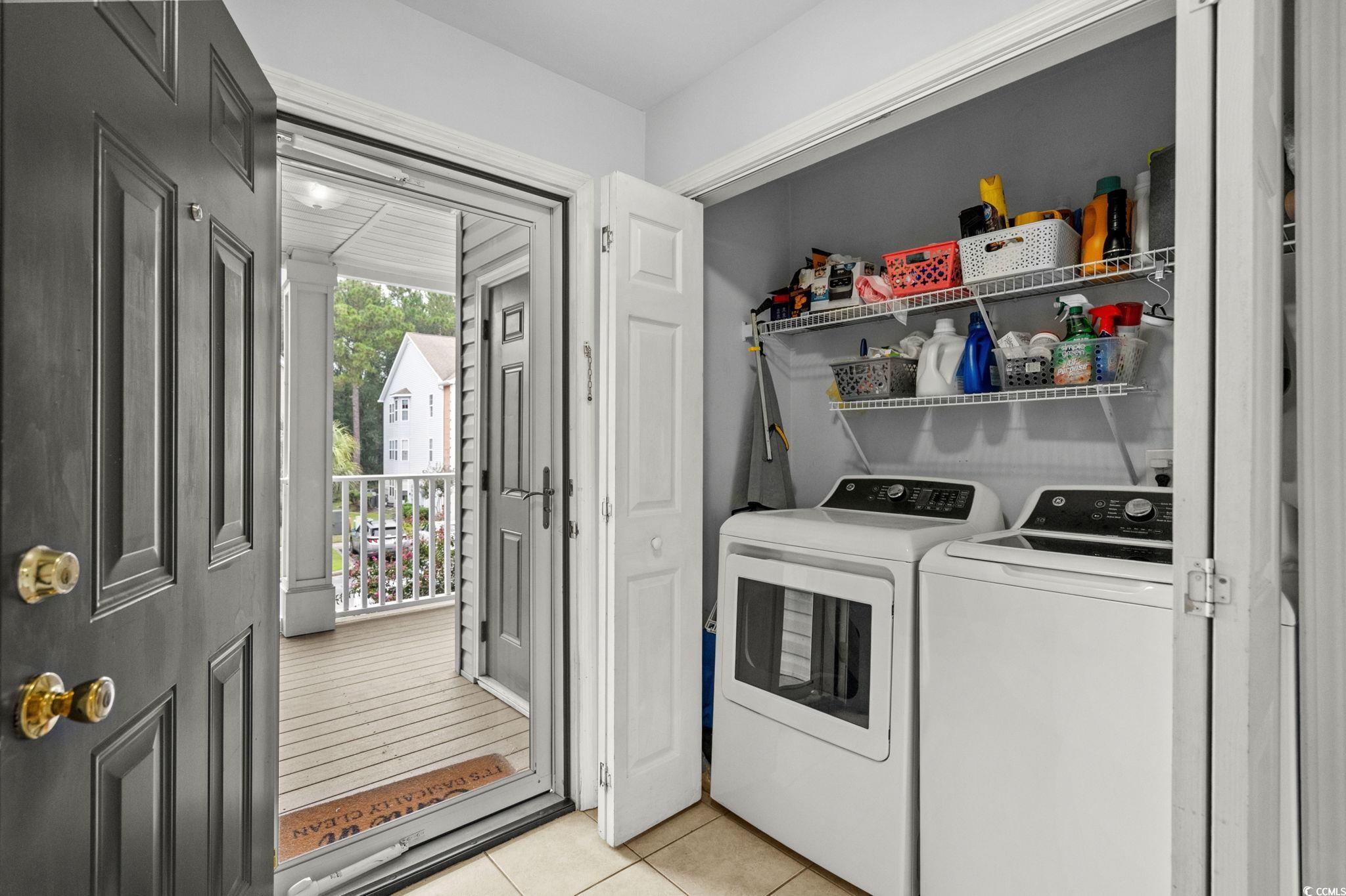 4849 Meadowsweet Drive, Unit 1606 Myrtle Beach, SC 29579 - Photo 25 of 36 Laundry area with light tile patterned flooring and separate washer and dryer