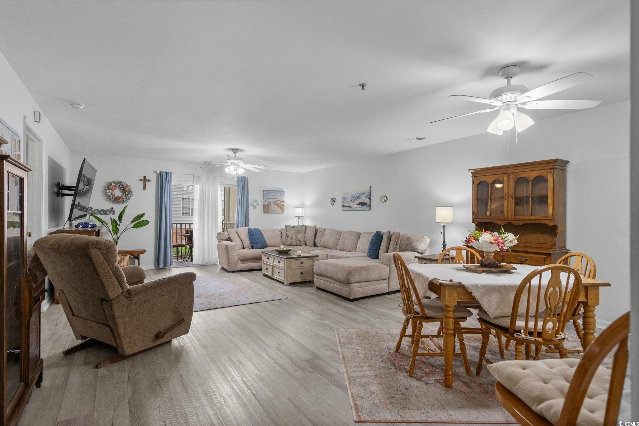 4849 Meadowsweet Drive, Unit 1606 Myrtle Beach, SC 29579 - Photo 5 of 36 Living room with ceiling fan and light wood finished floors