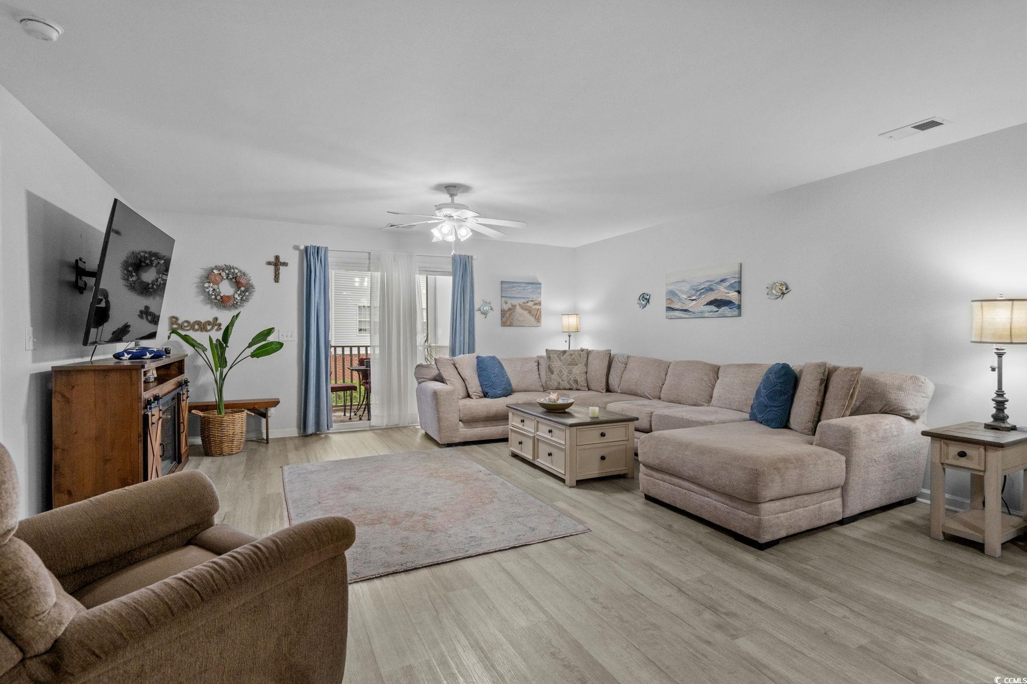 4849 Meadowsweet Drive, Unit 1606 Myrtle Beach, SC 29579 - Photo 6 of 36 Living room featuring light wood-type flooring and a ceiling fan