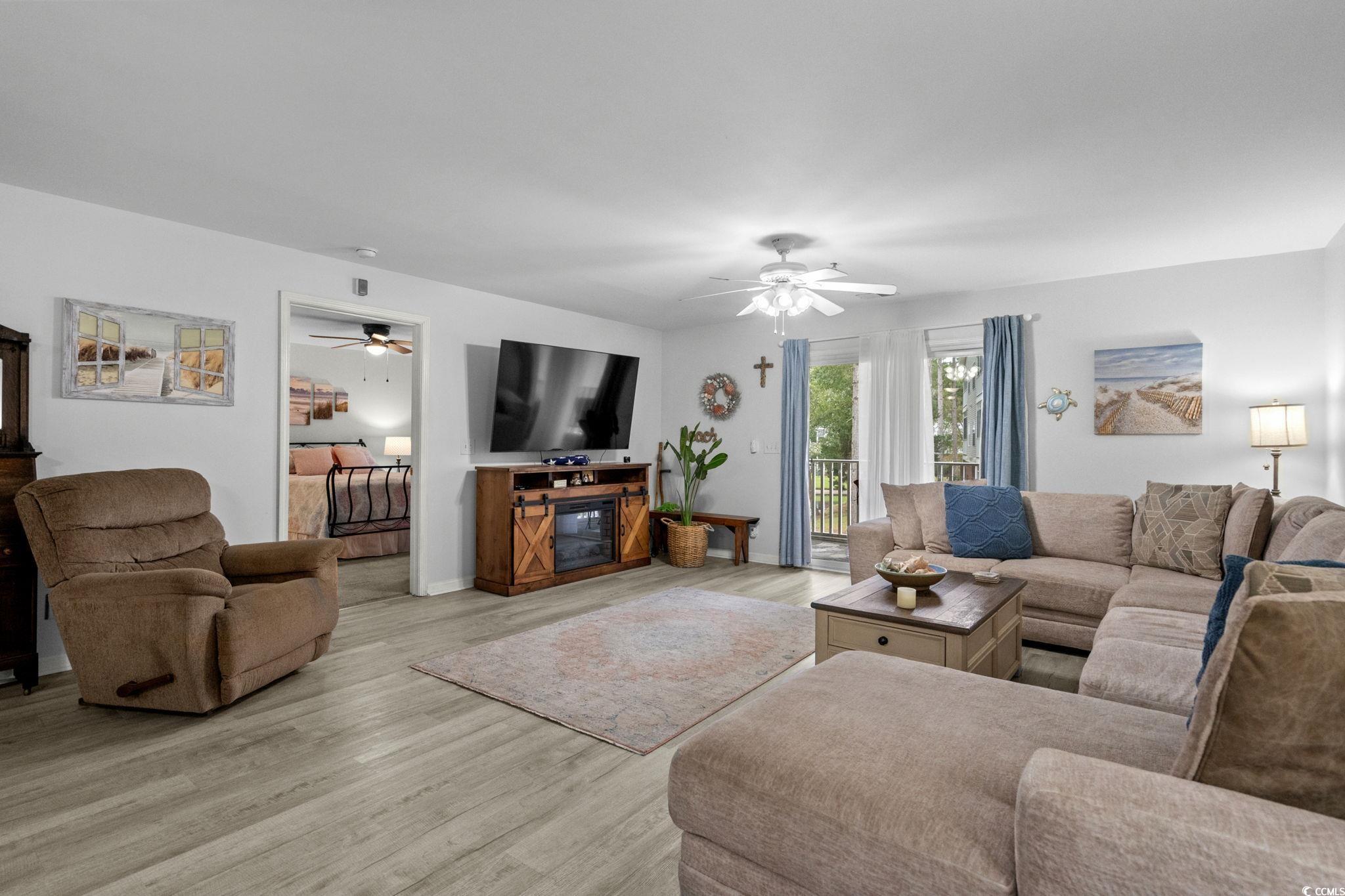 4849 Meadowsweet Drive, Unit 1606 Myrtle Beach, SC 29579 - Photo 7 of 36 Living room with wood finished floors and baseboards