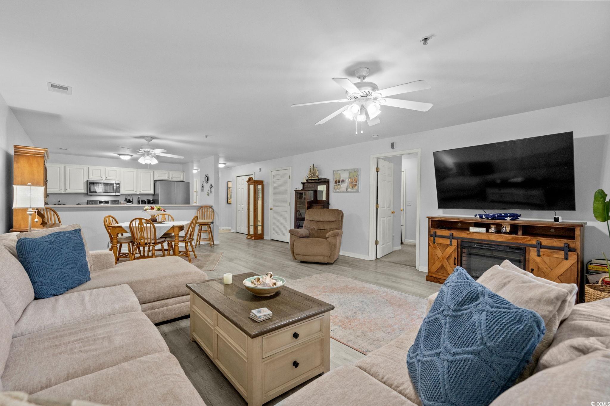 4849 Meadowsweet Drive, Unit 1606 Myrtle Beach, SC 29579 - Photo 8 of 36 Living room with wood finished floors and a ceiling fan