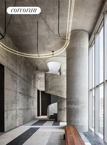 a living room with furniture a window and a table