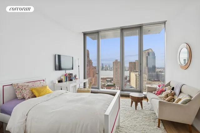 a bedroom with a bed and a chair