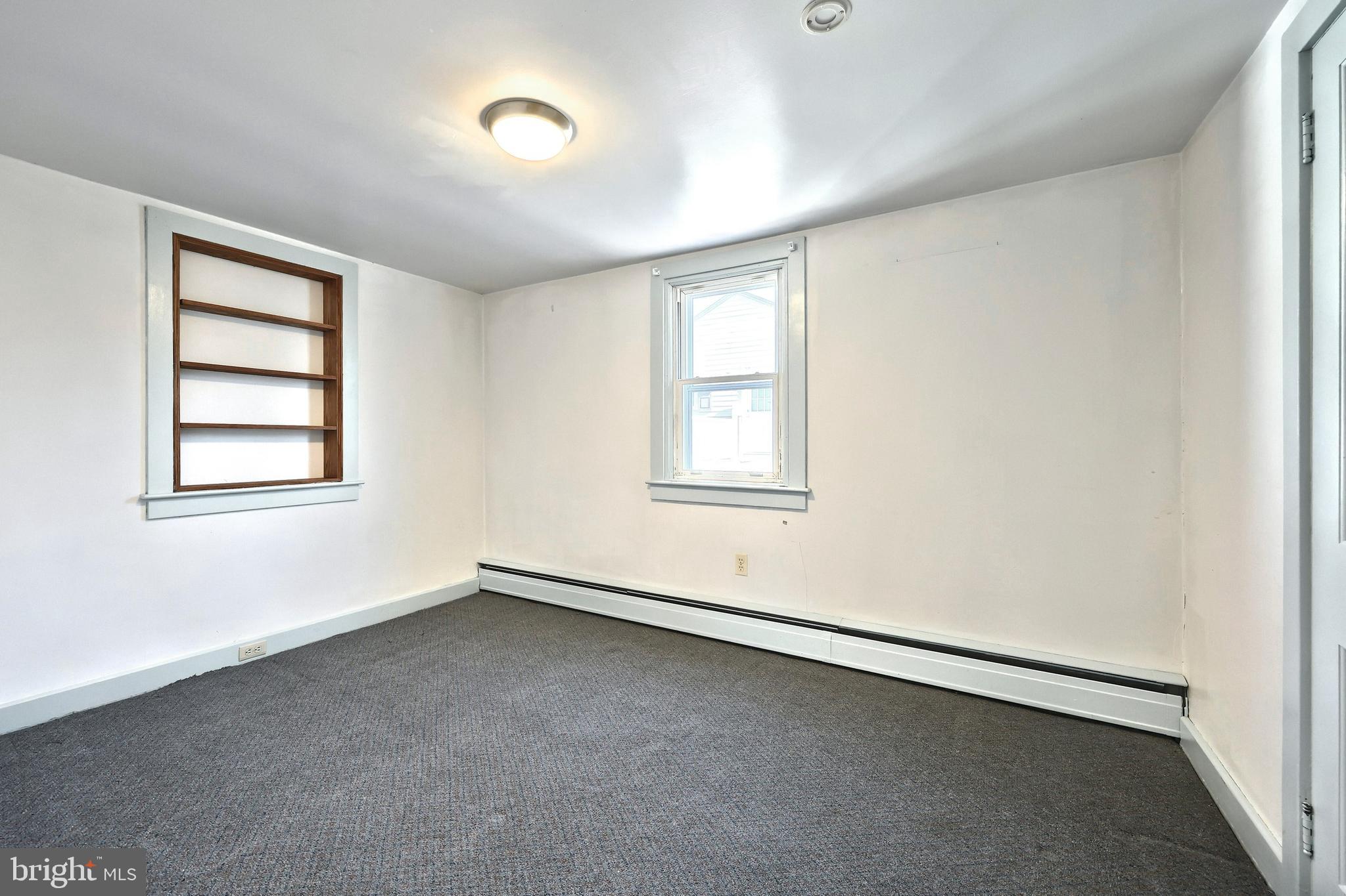64 Baltimore Street Spring Grove, PA 17362 - Photo 13 of 58 an empty room with windows
