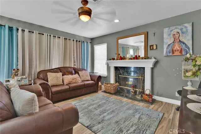 a living room with furniture and a fireplace