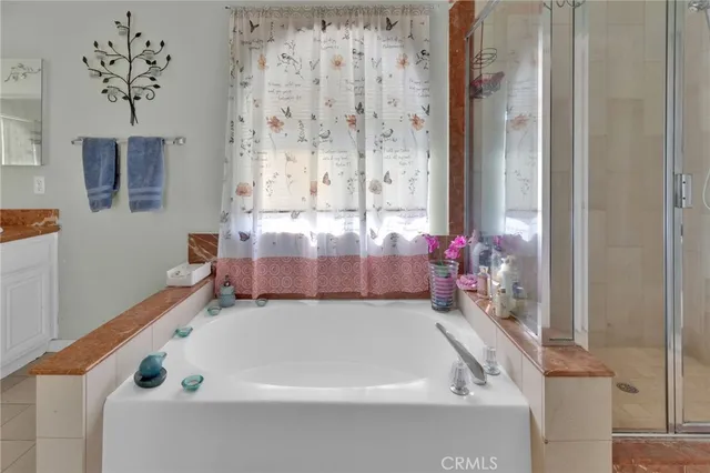 a white bath tub sitting next to a white sink
