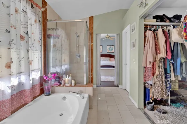 a bathroom with a bathtub and a shower