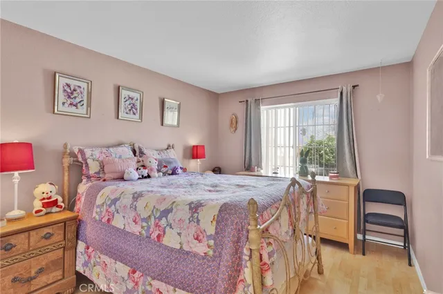 a bedroom with a bed and a table in it