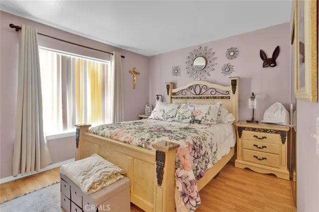 a bedroom with a bed and a table in it