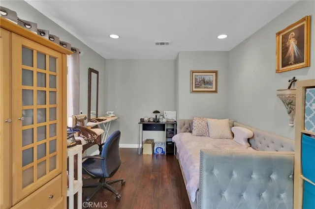 a bedroom with furniture and a window