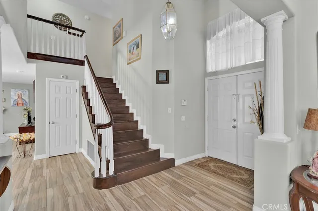 a view of entryway with wooden floor