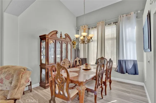 a view of a dining room with furniture and window
