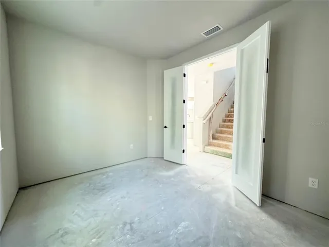 an empty room with windows