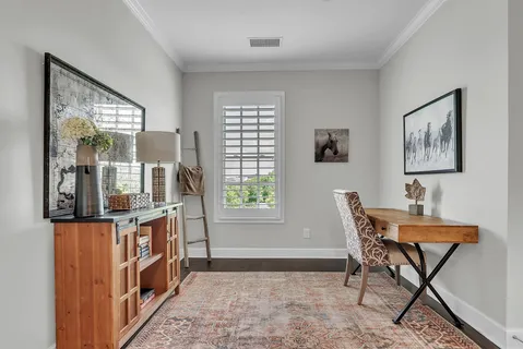 a dining room with furniture and window