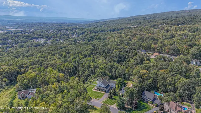 an aerial view of houses with yard