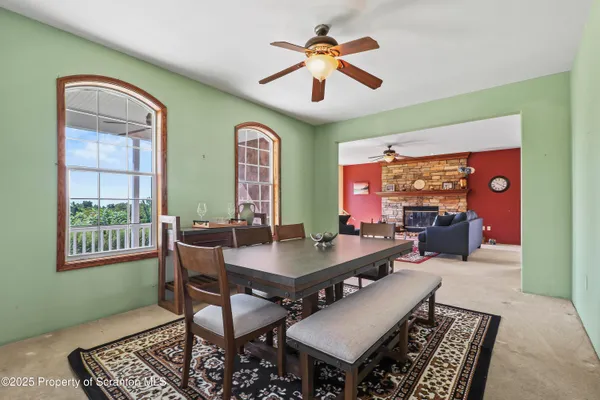 a view of a livingroom with furniture and a window