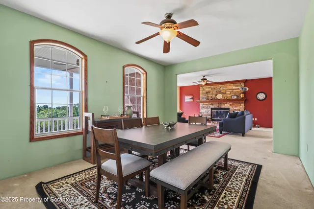 a view of a livingroom with furniture and a window