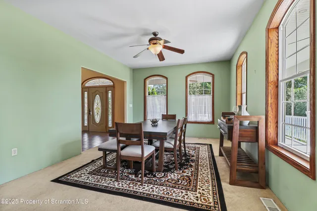 a view of a livingroom with furniture and window