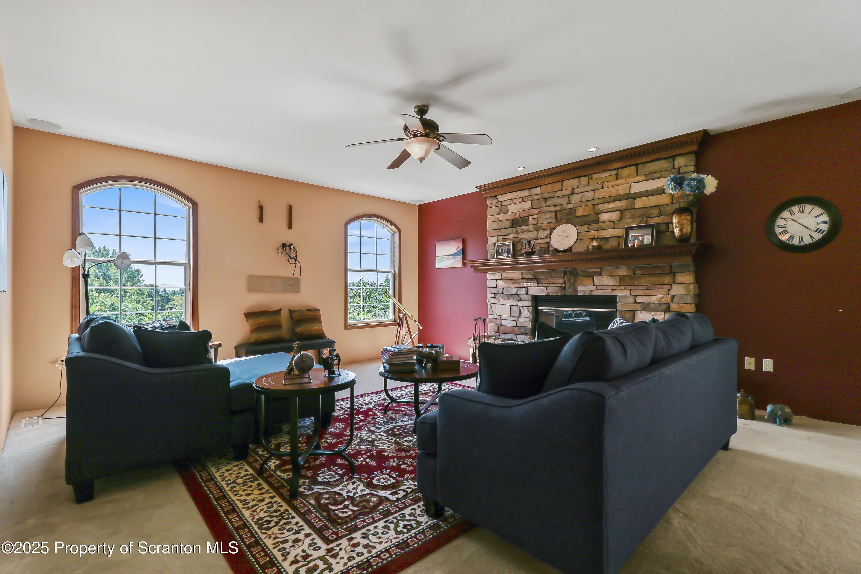 107 Ridgeview Drive Scranton, PA 18504 - Photo 20 of 48 a living room with furniture a rug and a window