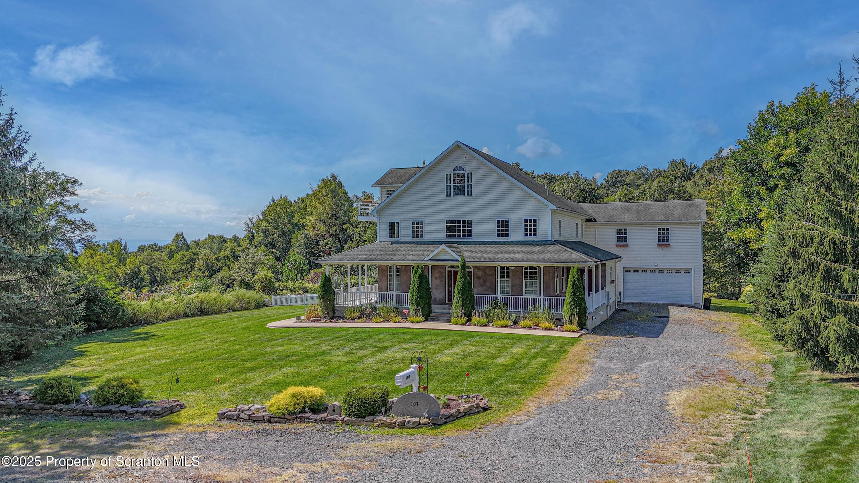 107 Ridgeview Drive Scranton, PA 18504 - Photo 2 of 48 a front view of a house with a yard