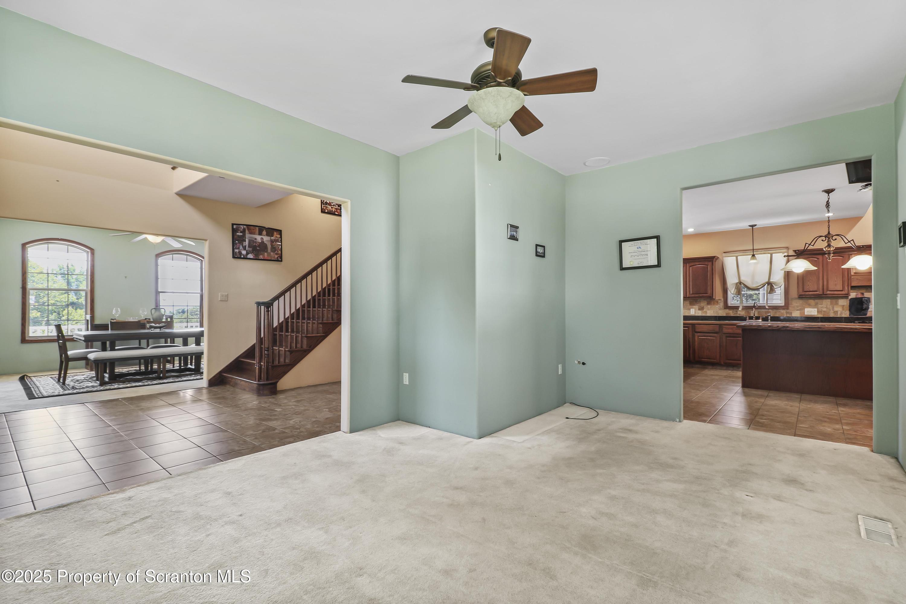 107 Ridgeview Drive Scranton, PA 18504 - Photo 22 of 48 a view of a livingroom with wooden floor and staircase