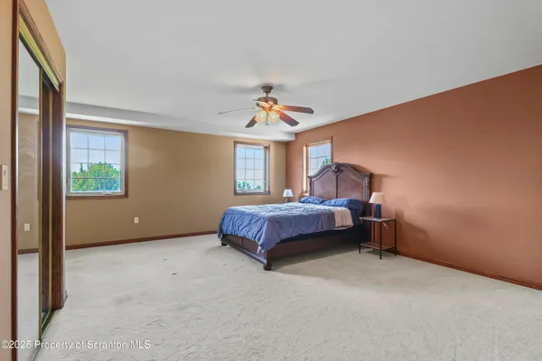 a bed room with a bed and a window